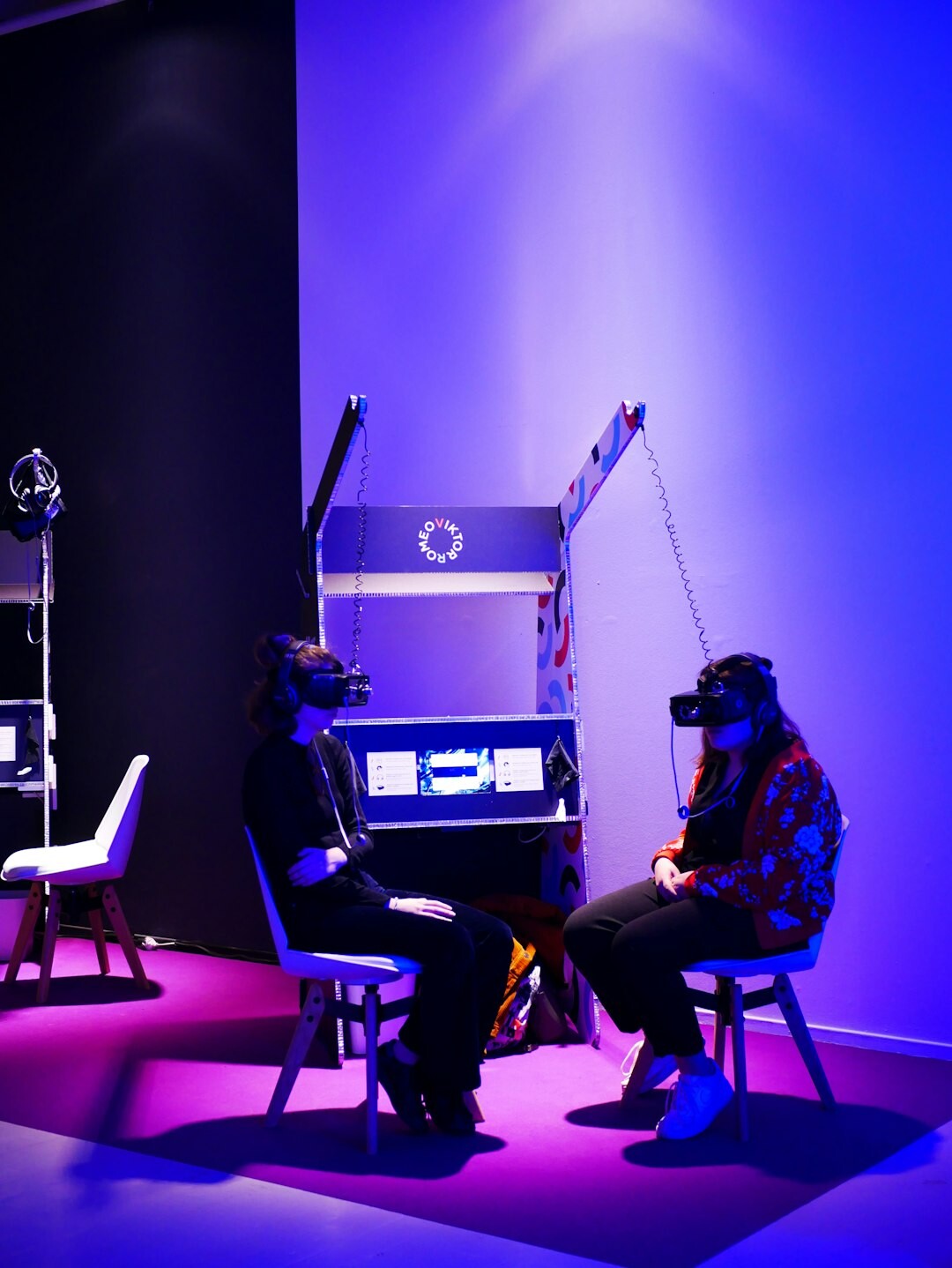 Two guests in a heated discussion on a TV studio set