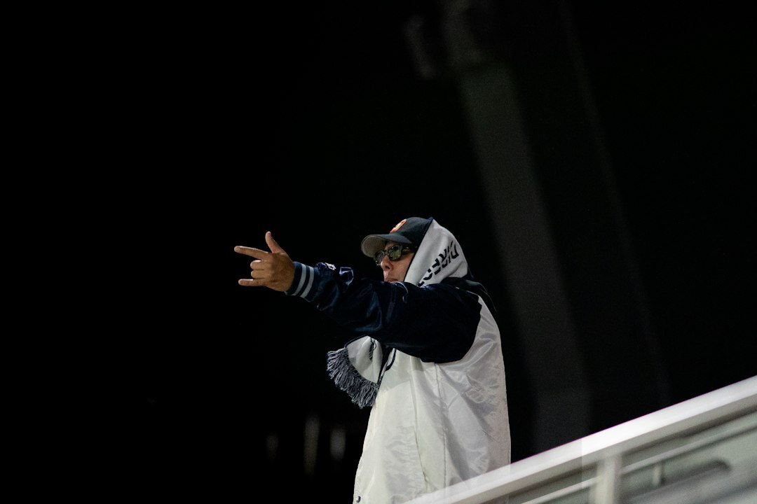 Floor manager coordinating a live broadcast with hand signals